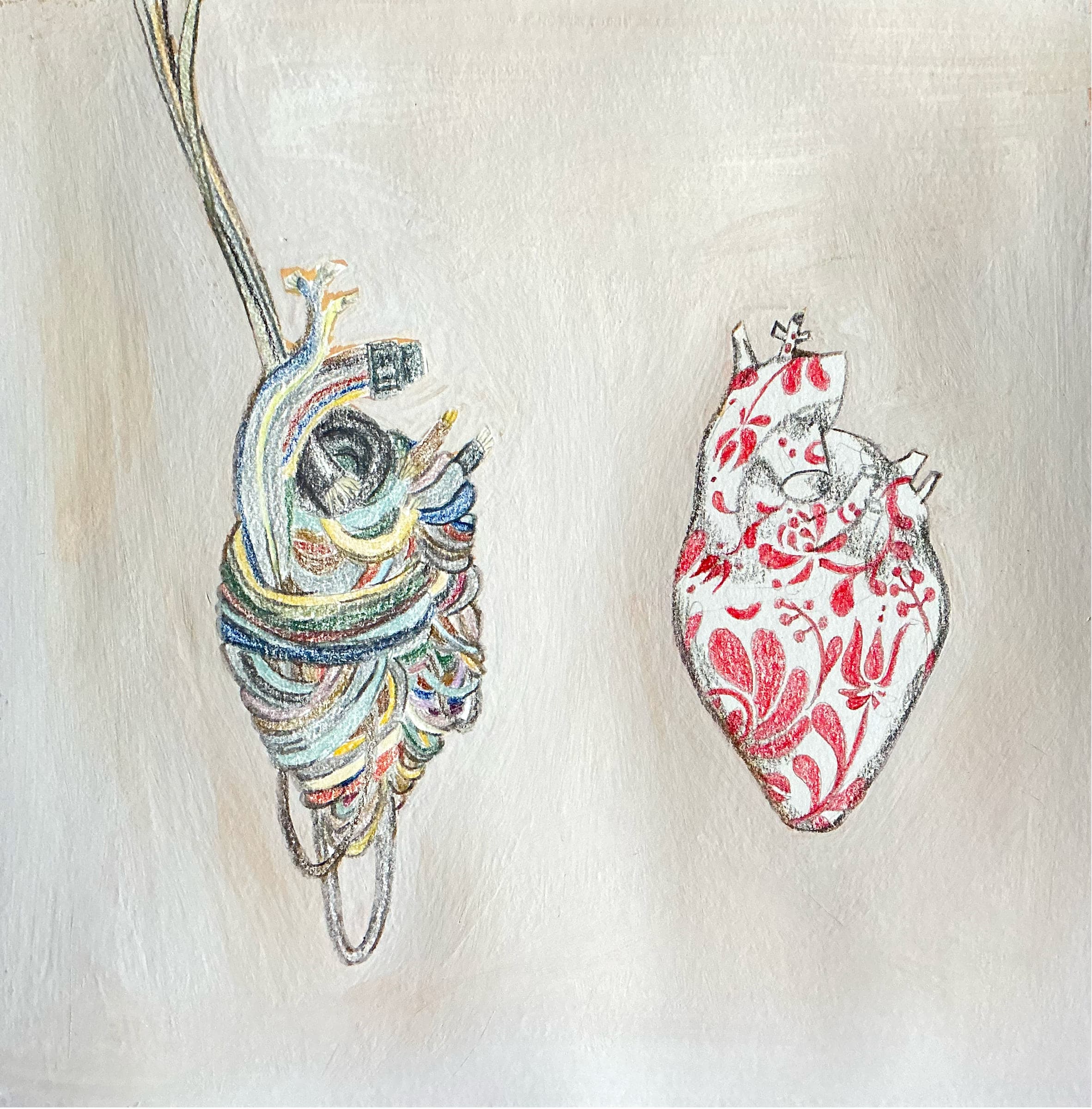 Two anatomical hearts side by side: one bound in tangled coloured wires and cables, the other patterned with red Hungarian folk-art florals.